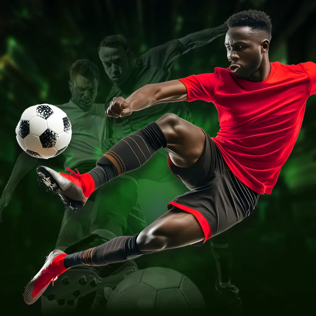 A soccer player in a red shirt and black shorts performs an acrobatic kick with focused intensity against a dynamic green background with blurred figures.